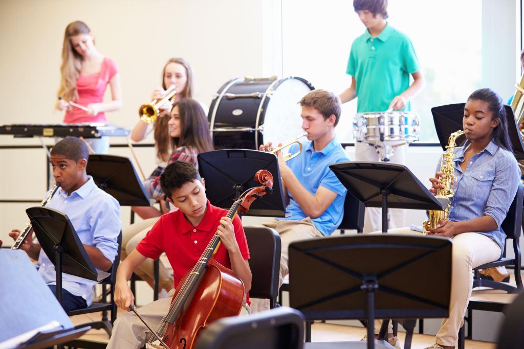 Pupils Playing Musical Instruments In School Orchestra